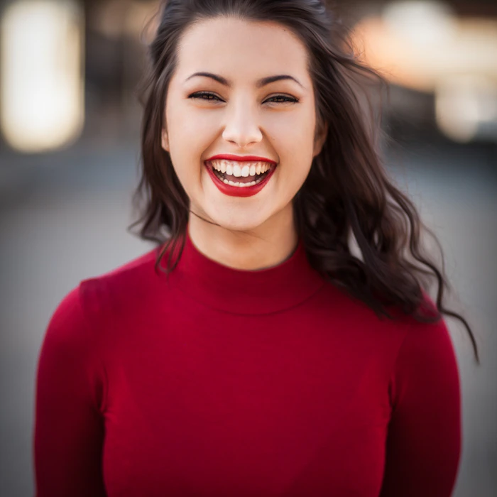 Smiling beauty portrait in red